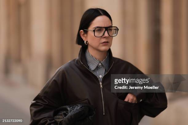Maria Barteczko seen wearing Victoria Beckham black oversized Aviator glasses, The Frankie Shop brown leather windbreaker / bomber leather jacket,...