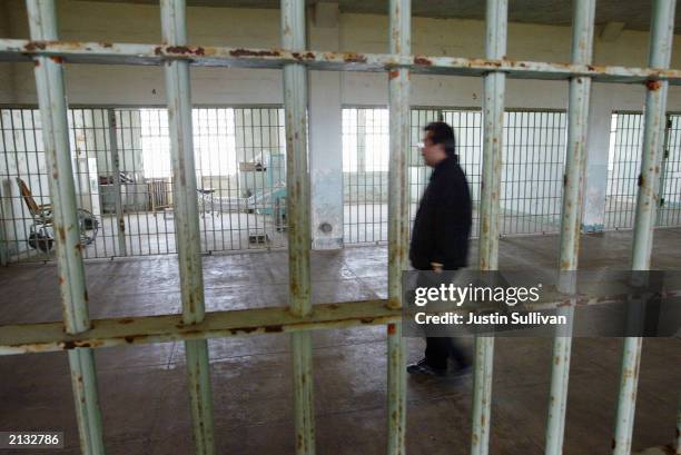 Golden Gate National Recreation Area worker Edwin Sera walks through the hospital of the Alcatraz Federal Penitentiary on Alcatraz Island July 2,...