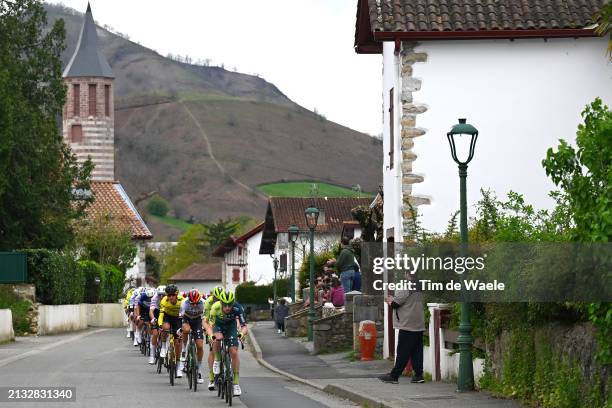 Emanuel Buchmann of Germany and Roger Adria of Spain and Team BORA - hansgrohe lead the peloton passing through Ortzaize village during the 63rd...