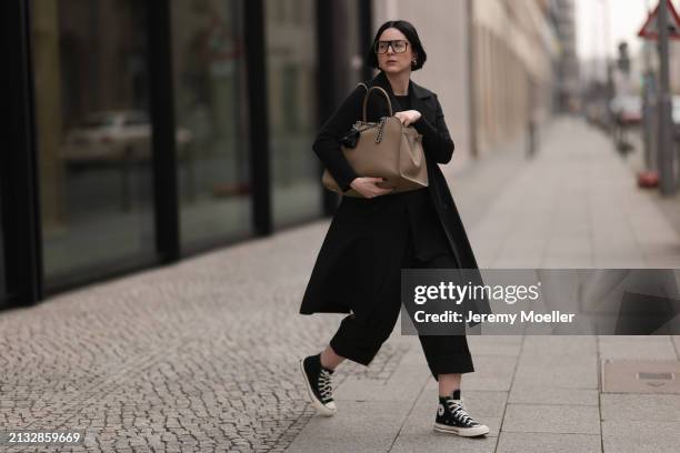 Maria Barteczko seen wearing Victoria Beckham black oversized Aviator glasses, WENDYKEI black cotton long sleeve top, WENDYKEI black long sleeveless...