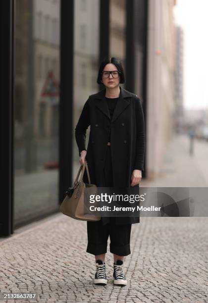 Maria Barteczko seen wearing Victoria Beckham black oversized Aviator glasses, WENDYKEI black cotton long sleeve top, WENDYKEI black long sleeveless...
