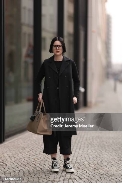 Maria Barteczko seen wearing Victoria Beckham black oversized Aviator glasses, WENDYKEI black cotton long sleeve top, WENDYKEI black long sleeveless...