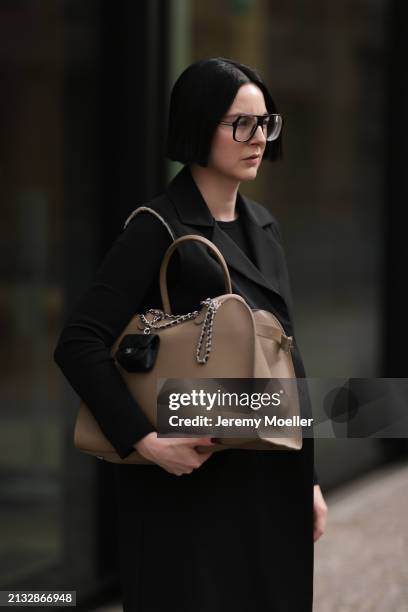 Maria Barteczko seen wearing Victoria Beckham black oversized Aviator glasses, WENDYKEI black cotton long sleeve top, WENDYKEI black long sleeveless...