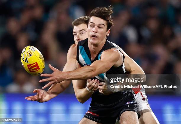 Connor Rozee of the Power is tackled by Zach Merrett of the Bombers during the 2024 AFL Round 04 match between the Port Adelaide Power and the...