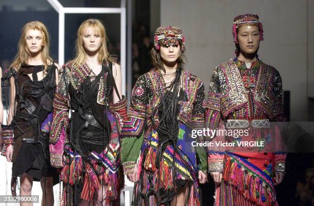 Natalia Vodianova, Anne Vyalitsyna, Liliana Dominguez and Dawning Han walk the runway during the Hussein Chalayan Ready to Wear Fall/Winter 2002-2003...