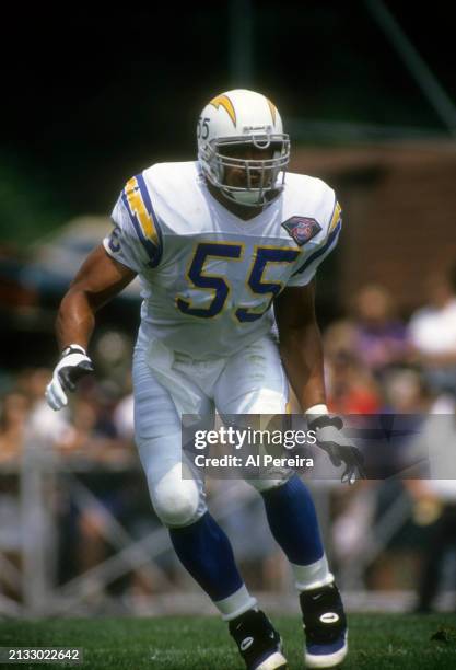 Outside Linebacker Junior Seau of the San Diego Chargers follows the action in the Pro Football Hall of Fame game between the San Diego Chargers vs...