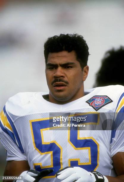 Outside Linebacker Junior Seau of the San Diego Chargers follows the action in the Pro Football Hall of Fame game between the San Diego Chargers vs...