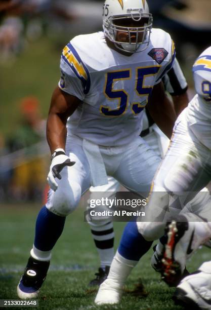 Outside Linebacker Junior Seau of the San Diego Chargers follows the action in the Pro Football Hall of Fame game between the San Diego Chargers vs...