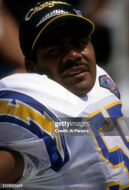 Outside Linebacker Junior Seau of the San Diego Chargers follows the action in the Pro Football Hall of Fame game between the San Diego Chargers vs...