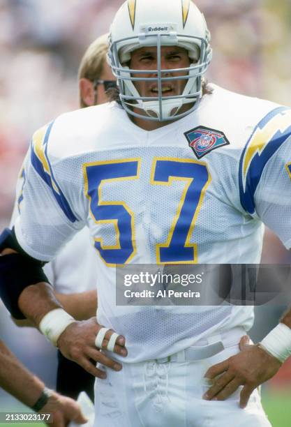Middle Linebacker Dennis Gibson of the San Diego Chargers follows the action in the Pro Football Hall of Fame game between the San Diego Chargers vs...