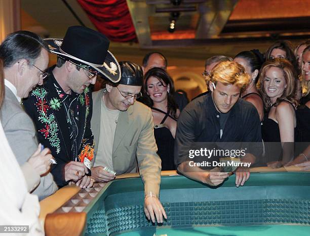 Actor David Arquette , actor Joe Pantoliano and actor Stephen Dorff prepare to wager on the 1st roll at at the opening of the Borgata Hotel Casino &...