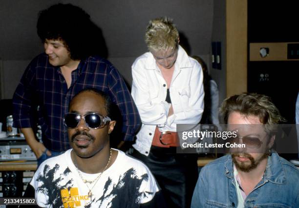 American singer Stevie Wonder, along with Scottish singer Annie Lennox and English musician Dave Stewart, of the British pop duo Eurythmics, work on...