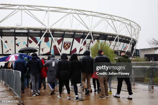 General view outside the stadium as fans arrive prior to the Premier League match between West Ham United and Tottenham Hotspur at the London Stadium...