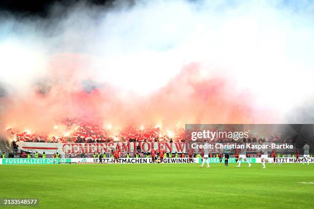Kaiserslautern show their support with flares prior to the DFB Cup semifinal match between 1. FC Saarbrücken and 1. FC Kaiserslautern at the...