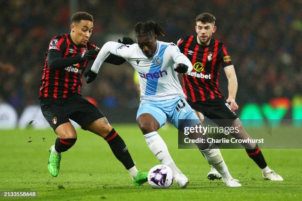 Eberechi Eze of Crystal Palace is challenged by Marcus Tavernier and Ryan Christie of AFC Bournemouth during the Premier League match between AFC...