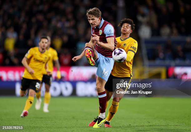 Sander Berge of Burnley is challenged by Leon Chiwome of Wolverhampton Wanderers during the Premier League match between Burnley FC and Wolverhampton...