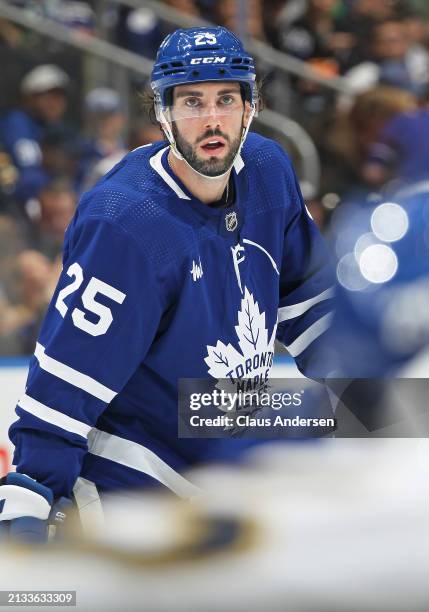 Conor Timmins of the Toronto Maple Leafs waits for a puck drop against the Florida Panthers during the second period in an NHL game at Scotiabank...