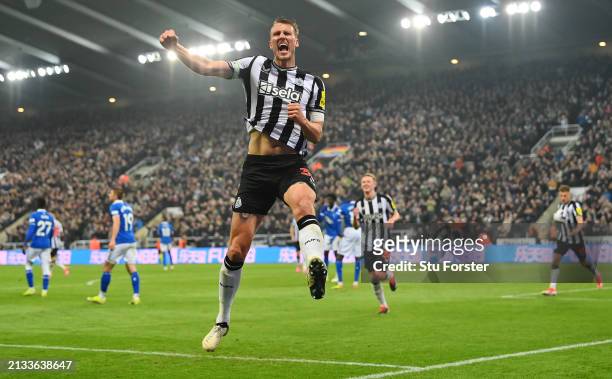 Dan Burn of Newcastle United celebrates after scoring a goal which was later ruled out for offside during the Premier League match between Newcastle...