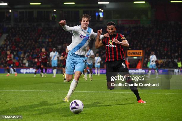 Joachim Andersen of Crystal Palace is challenged by Lloyd Kelly of AFC Bournemouth during the Premier League match between AFC Bournemouth and...