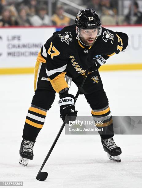 Bryan Rust of the Pittsburgh Penguins looks on in the first period during the game against the Columbus Blue Jackets at PPG PAINTS Arena on March 28,...