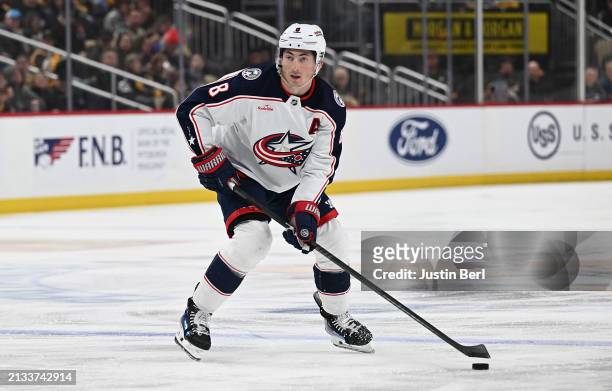 Zach Werenski of the Columbus Blue Jackets skates with the puck in the second period during the game against the Pittsburgh Penguins at PPG PAINTS...