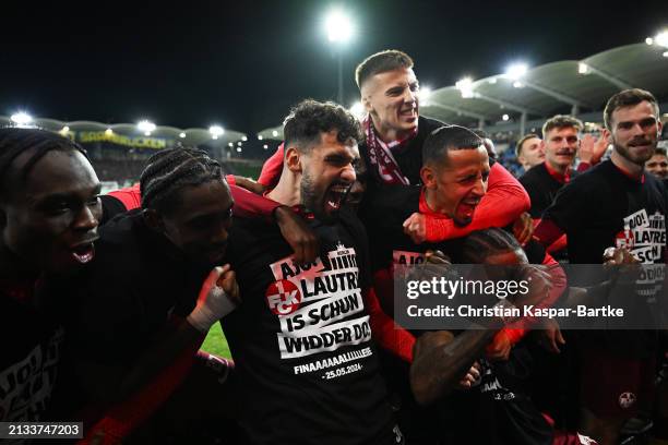 Avdo Spahic and Kenny Prince Redondo of 1. FC Kaiserslautern celebrate after the team's victory during the DFB Cup semifinal match between 1. FC...
