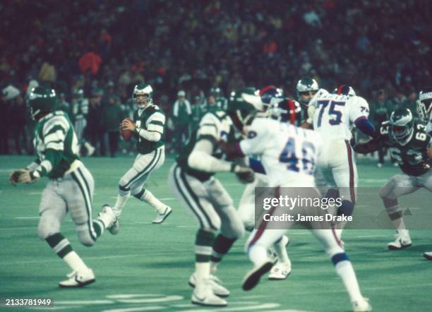 Philadelphia Eagles quarterback Ron Jaworski looks to pass towards the sideline during a wildcard playoff game against the New York Giants on...