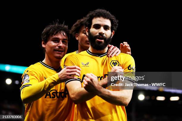 Rayan Ait-Nouri of Wolverhampton Wanderers celebrates after scoring his team's first goal with Hugo Bueno and Leon Chiwome during the Premier League...