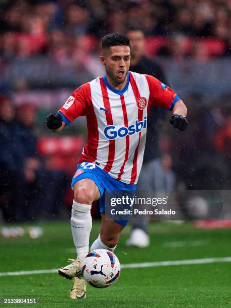 Yan Couto of Girona FC with the ball during the LaLiga EA Sports match between Girona FC and Real Betis at Montilivi Stadium on March 31, 2024 in...