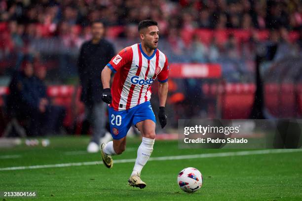 Yan Couto of Girona FC with the ball during the LaLiga EA Sports match between Girona FC and Real Betis at Montilivi Stadium on March 31, 2024 in...