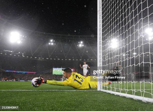 Guglielmo Vicario of Tottenham Hotspur makes a save during the Premier League match between West Ham United and Tottenham Hotspur at London Stadium...