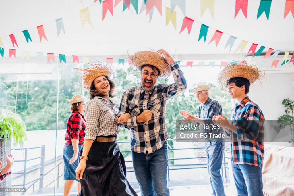 Portrait of a mature couple dancing on a brazilian Junina party