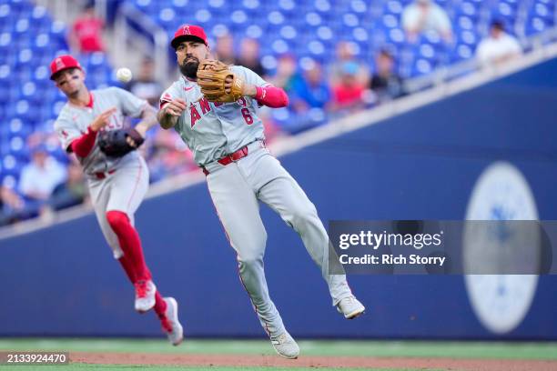 Anthony Rendon of the Los Angeles Angels throws the ball to first base for an out against the Miami Marlins during the first inning at loanDepot park...