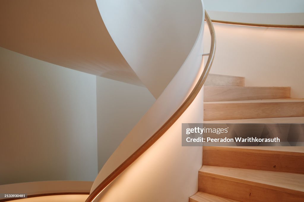 Staircase featuring a smooth curve.