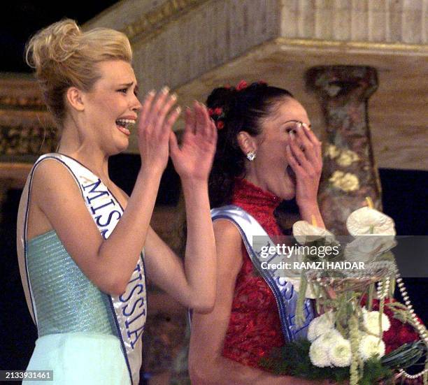 Miss Russia Elena Rogojina and Miss Italy Cristina Cellai react as Rogojina was elected Miss Europe in Beirut 25 June 1999. Thirty-six European...