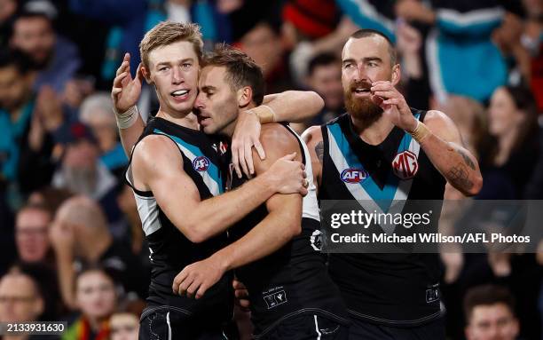 Todd Marshall , Jeremy Finlayson and Charlie Dixon of the Power celebrate during the 2024 AFL Round 04 match between the Port Adelaide Power and the...