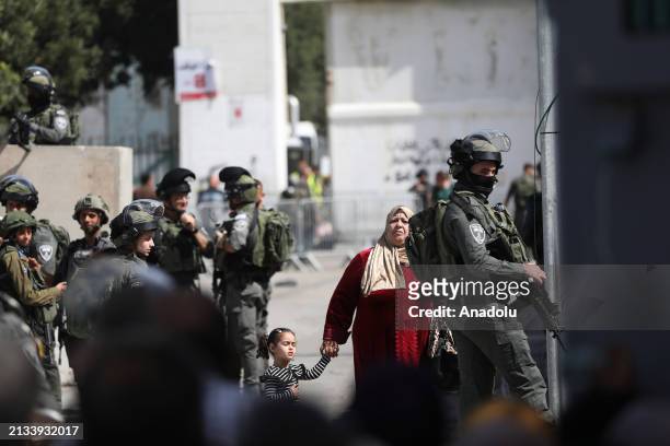 Israeli forces take strict security measures as the Palestinians try to cross from the Israeli military checkpoint separating Bethlehem and...
