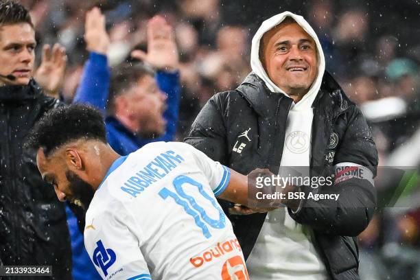 Pierre-Emerick Aubameyang of Marseille interacts with Coach Luis Enrique of Paris Saint-Germain during the Ligue 1 Uber Eats match between Olympique...
