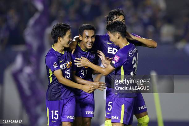 Teerasil Dangda of Sanfrecce Hiroshima celebrates with teammates after scoring the team's fourth goal during the J.League J1 match between Sanfrecce...