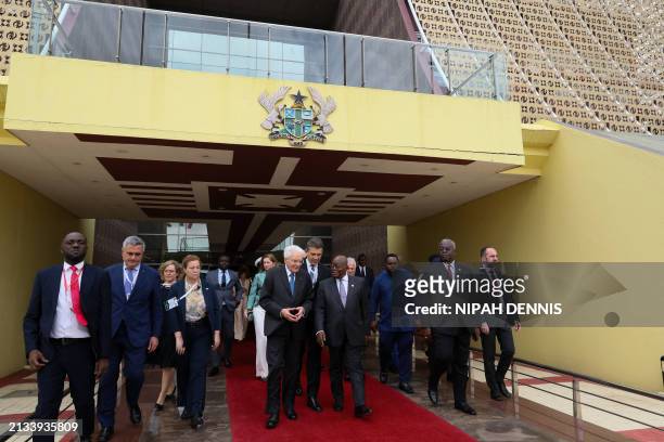 Italian President Sergio Mattarella gestures as he walks with Ghanaian President Nana Addo Dankwa Akufo-Addo after their meeting at the Jubilee House...
