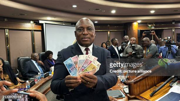 April 2024, Zimbabwe, Harare: John Mushayavanhu, Governor of the Reserve Bank of Zimbabwe, presents the new national currency Zimbabwe Gold, or ZiG...