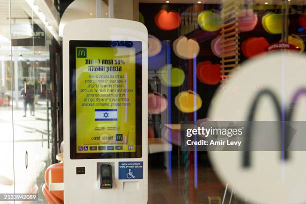 Sign offers 50 percent off for Israeli soldiers in a McDonald's restaurant branch on April 5, 2024 in Zichron Ya'akov, Israel. The McDonald's...