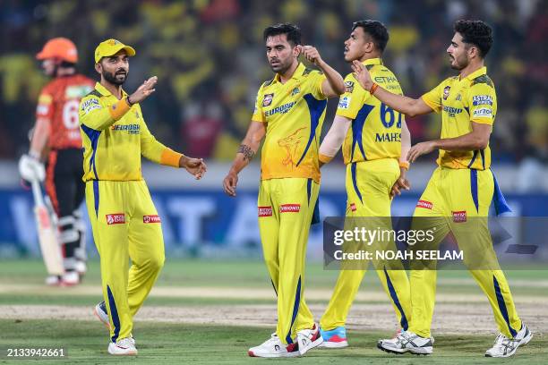 Chennai Super Kings' Deepak Chahar celebrates with teammates after taking the wicket of Sunrisers Hyderabad's Abhishek Sharma during the Indian...