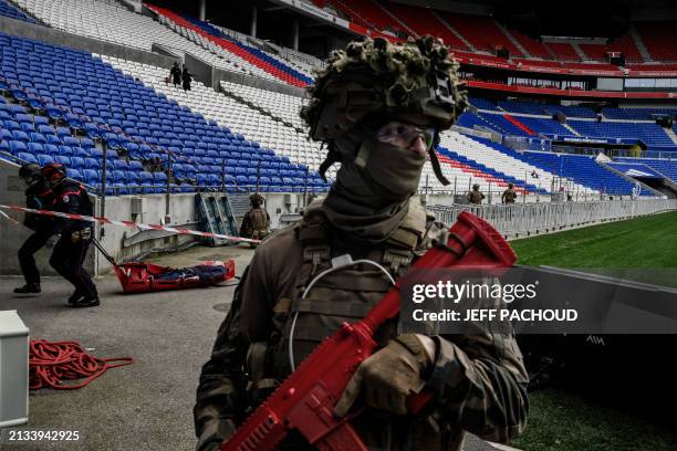 Police officers, military personnel, rescue workers and firefighters take part in an exercise simulating a terrorist attack on April 5, 2024 at the...