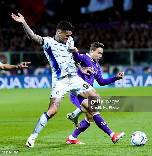Gianluca Scamacca of Atalanta BC and Arthur of ACF Fiorentina compete for the ball during the Coppa Italia Semi-Final 1st leg match between ACF...