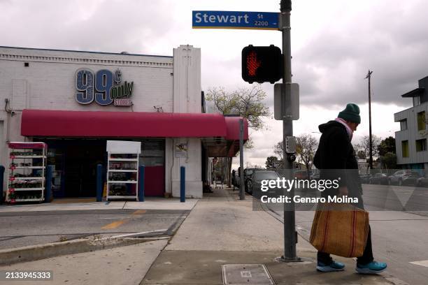 Andrew Liberman leaves with his purchases from the 99 Cent Only store in Santa Monica on April 5, 2024. The stores will be closing soon. "I think it...