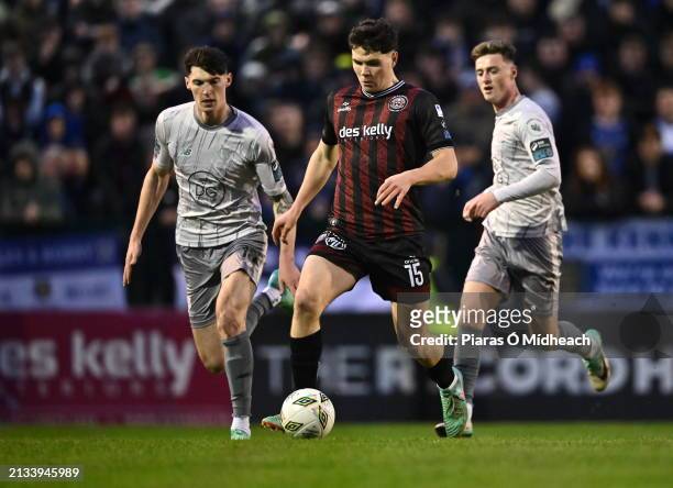 Dublin , Ireland - 5 April 2024; James Clarke of Bohemians in action against Harvey Macadam, left, and Ben McCormack of Waterford during the SSE...