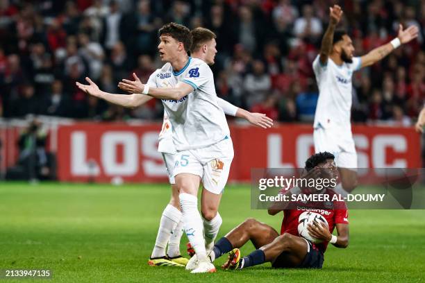 Marseille's Italian Argentinian defender Leonardo Balerdi reacts during the French L1 football match between Lille LOSC and Olympique Marseille at...