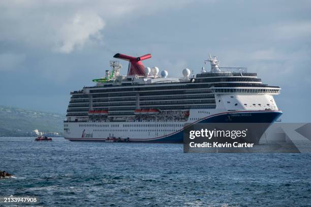 The Carnival Miracle cruise ship is anchored in the Pacific Ocean near Kailua Bay during a 15-day cruise on January 14, 2024 in Kailua-Kona, Hawaii.