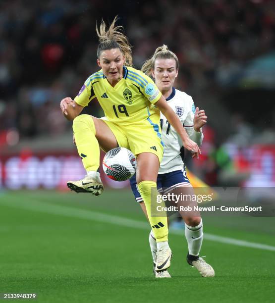 Sweden's Johanna Rytting Kaneryd and England's Lauren Hemp during the UEFA Women's European Qualifier match between England and Sweden ar Wembley...